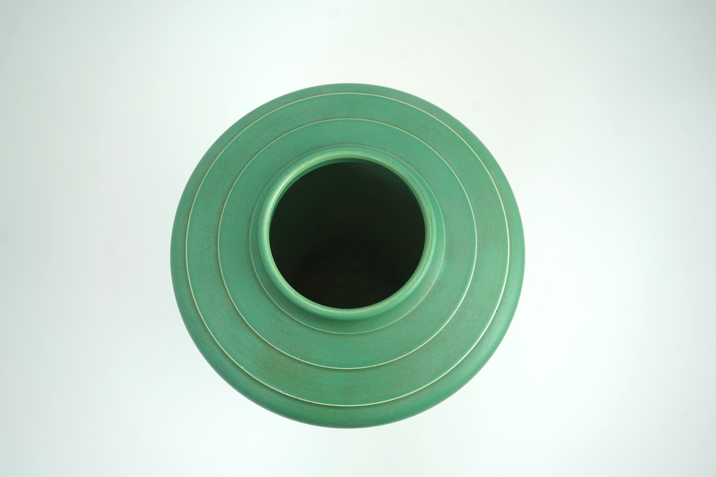Keith Murray MC RDI FRIBA (New Zealand/British, 1892-1981) for Wedgwood: A matt green glazed tapering vase
